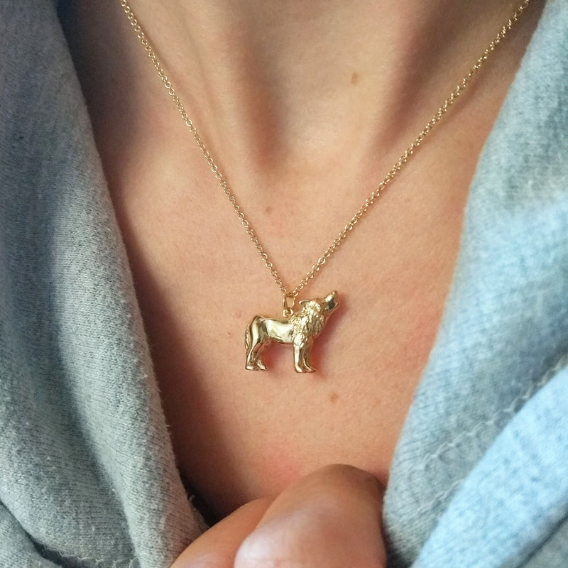Gold wolf on sale pendant